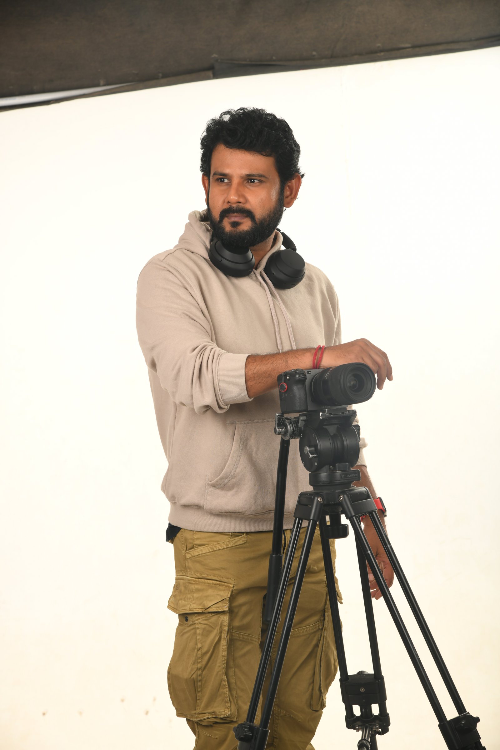 A fujifilm instant camera on a dark electric blue background.